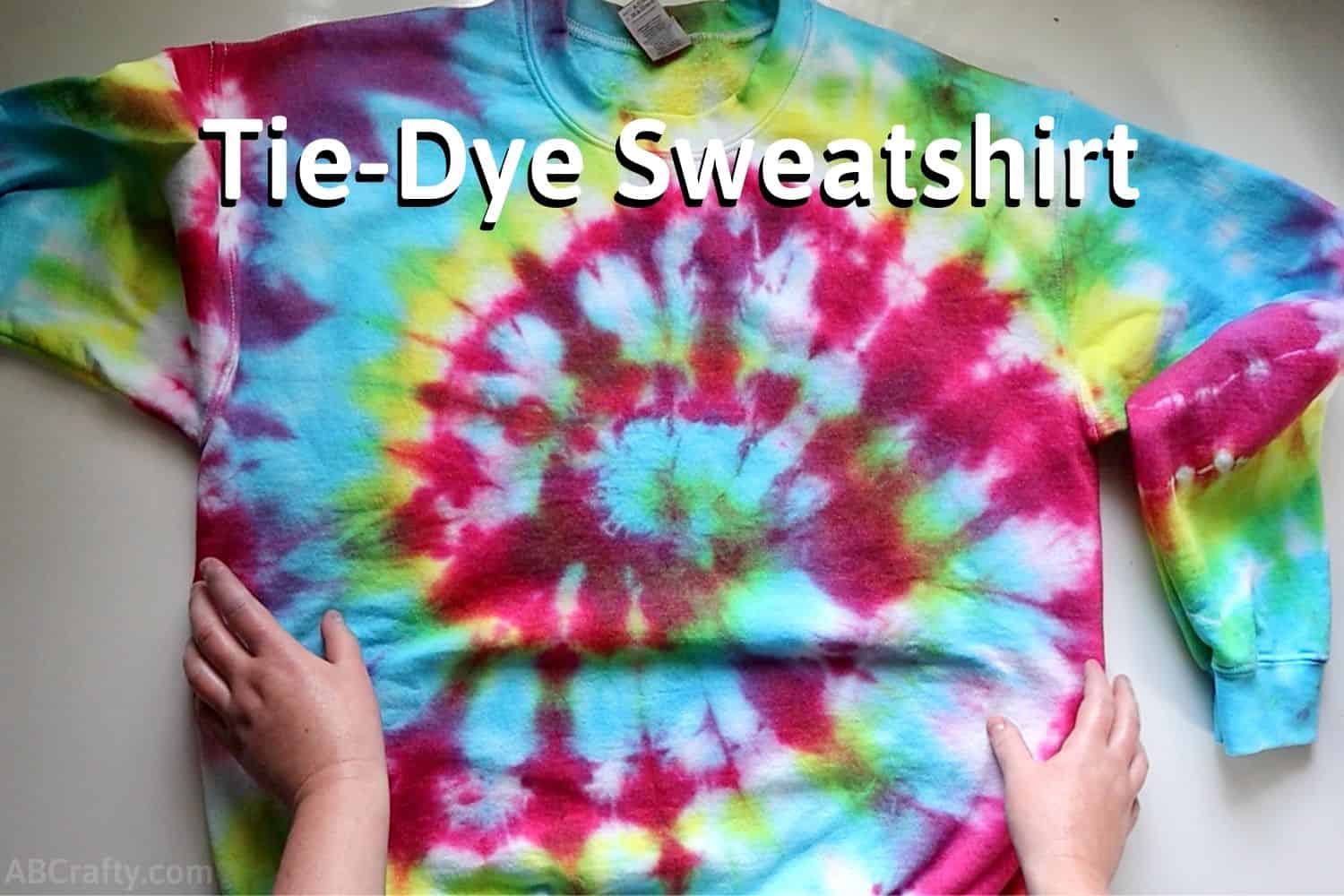 Watch and learn how to tie-dye swirling colours onto your bags and clothes  at home