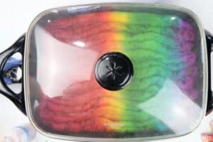 rainbow dyed wool in an electric skillet with the top on