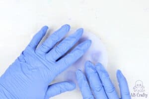 pressing on the top of the lets resin dice mold