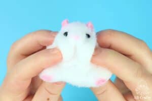 squishing the cheeks of a dhamster taba squishy