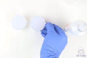 white liquid silicone in tow small measuring cups